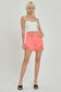 Zya RISEN Raw Hem Asymmetrical Waist Denim Shorts in Coral Pink